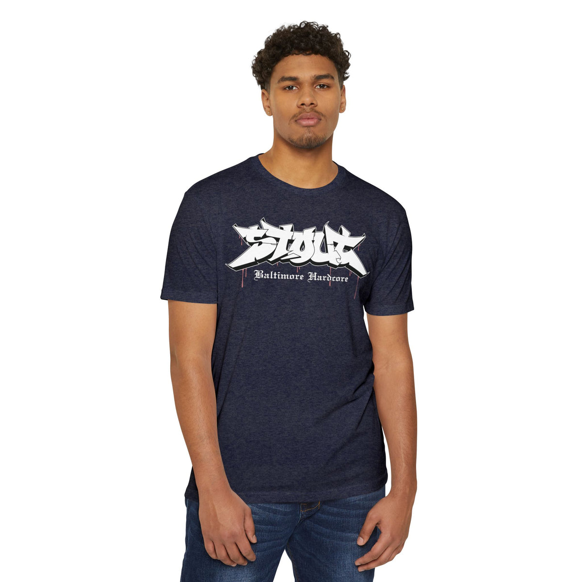Man wearing a navy blue t-shirt with a logo and text on a white background