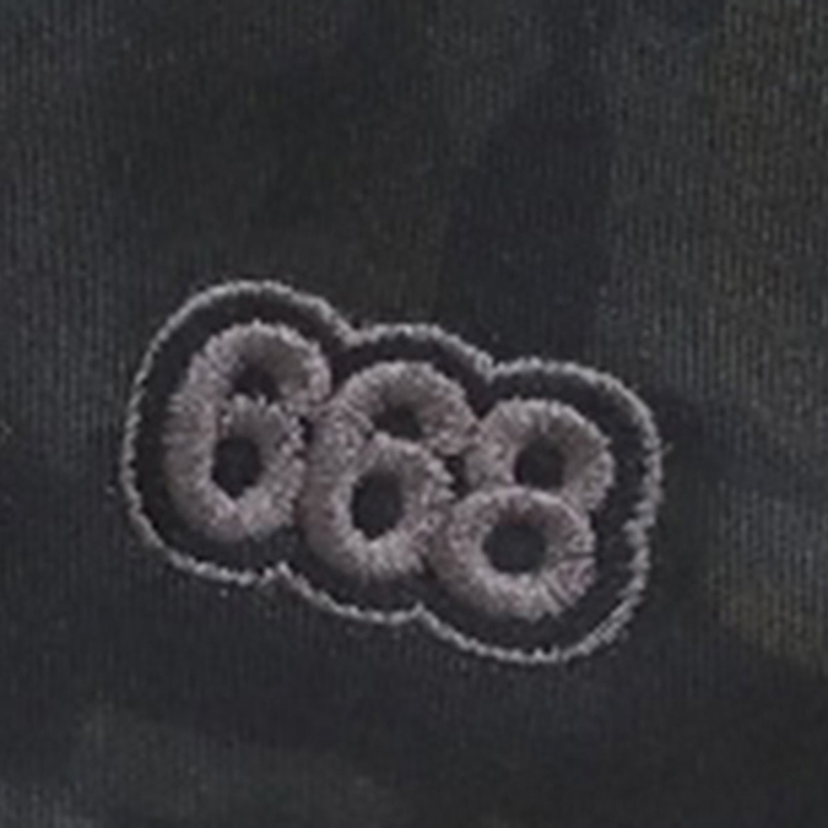Embroidered number '668' on a dark fabric background