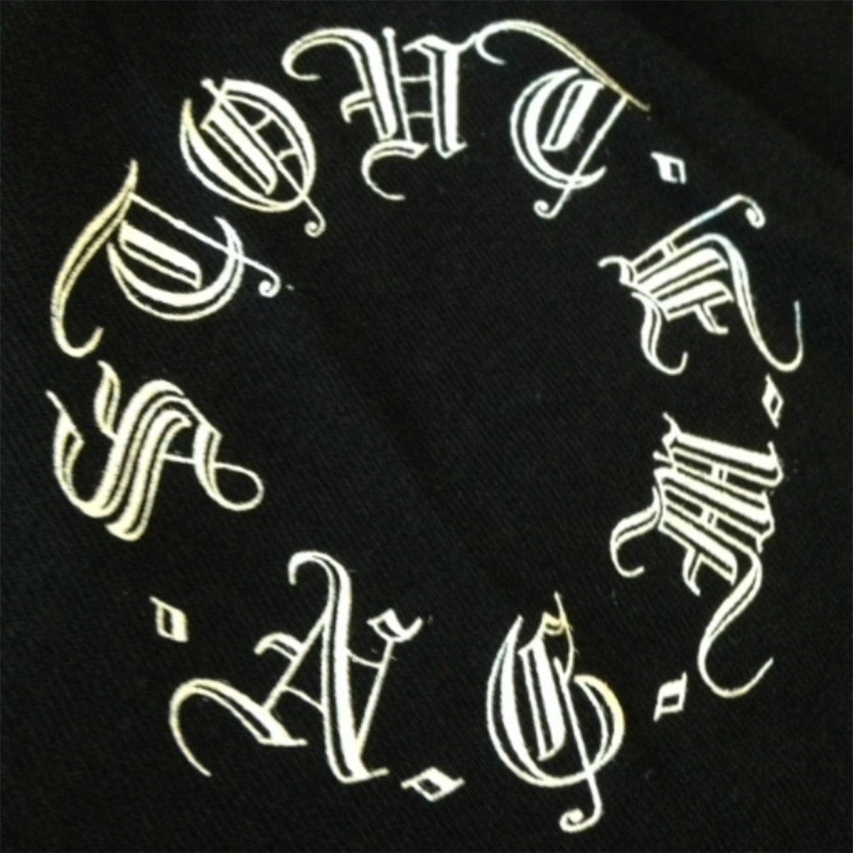 Decorative white text design STOUT NGMF on a black background